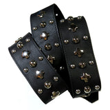 Rows of vintage silver hardware on a thick and supple black chap leather.