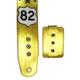 custom wireless transmitter pocket snap-on atttachment system displayed with a matching gold leather custom guitar strap 