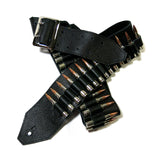 Black leather guitar strap with metal buckle and silver bullets