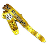 A metallic gold leather guitar strap featuring 'One Mississippi' in black script, a Route 66 '82' shield emblem, and gold studs and Swarovski Crystals.  Features a transmitter pocket on the back.
